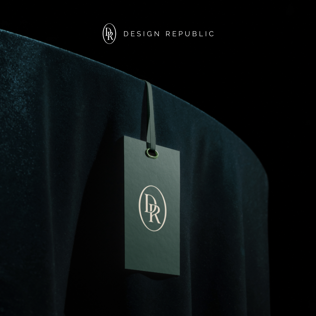AI Startups 8 A sleek black tag with the DR logo hangs on a luxurious dark green velvet fabric, symbolizing an exclusive design subscription. The text DESIGN REPUBLIC is elegantly displayed above in minimalist style, set against a dark background.